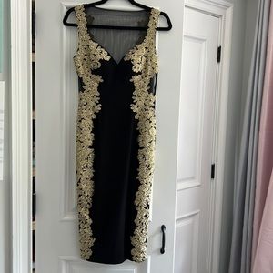 Black and gold formal midi dress. New never worn size 2.
